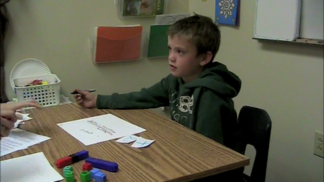 Jacob, a first grader, explains how he sums -5 and -2.